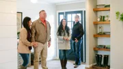 Homeowners Deanna and Paul King are all smiles as hosts Joanna and Chip show them their newly renovated home, as seen on Fixer Upper. (action)