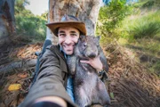 Coyote Peterson selfie with a wombat.