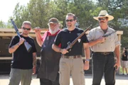 Adrian Alford, Larry Harley, Sean Rich, and Jim Green (left to right) pose stoically, showing off their respective, yet equally deadly, weapons.