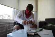 Location: San Francisco, USA: 'Seth' the MDMA dealer, bags up party supplies for his customers.