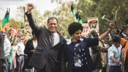 L - R: Nelson Mandela (Laurence Fishburne), Winnie Mandela (Terry Pheto)