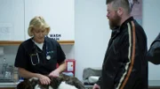 Dr. Dee examines Eric Gerke's new puppy.