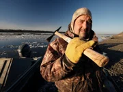 Charlie Wright holds his axe.