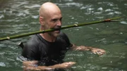 Ed Stafford gathers materials for his bushcraft as he wades through the water in Valley of the Gods, Taiwan