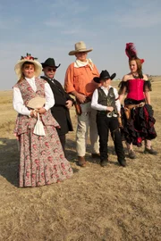 Dressed in full period garb, Pastor Nitro and the Pistoleros stand ready to show our experts how a quick draw competition was done in the Old West.