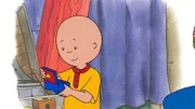 Caillou ist beistert von der Spieldose, die er auf dem Speicher gefunden hat.