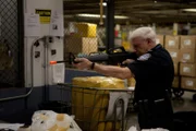 Jamaica, New York, USA: Customs and Border Protection officer Jerry Silverman plays with a toy BB gun, which he found in a traveler's suitcase.