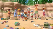 Judy Brown (3.v.l.), Mrs. Bird (4.v.l.), Paddington (vorne), Mr. Curry (4.v.r.), Jonathan Brown (3.v.r.), Mr. Brown (2.v.r.), Mrs. Brown (r.)