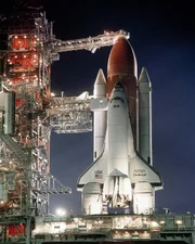 At the Kennedy Space Center in Florida, the rotating service structure has pulled back to the prelaunch position, the shuttle Challenger sits at Launch Pad 39-A bathed in billion candlepower searchlights ready to embark on it fourth space mission STS-41B, the 10th flight of the space shuttle.