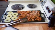 The chicken & pineapple slices cooking on the stovetop for Molly's Taco Pizza Al Pastor with Tomatillo Salsa, as seen on Girl Meets Farm, Season 3.