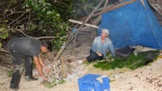 Myke and Ruth in shelter they built.