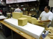 Mauro and Frankie work on building the Sesame St. buildings out of cereal treats.
