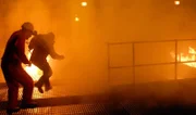 DRAMATIC REENACTMENT: Two oil rig workers on the Deepwater Horizon fight through the smoke and firestorms raging all around them. In April, 2010, a combination of mud, methane gas and water erupted on the rig. The material soon became fully gaseous, ignited, and a series of explosions and firestorms brought the rig eventually to the bottom of the Gulf of Mexico.