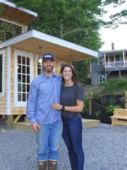 Oyster Farm owner Ryan poses with his girlfriend Briana in front of the newly built Oyster Farm shack, for Ryan McPherson's Oyster Farm Shack build, in Edgecomb, Maine, as seen on DIY Network's Maine Cabin Masters.