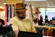 Tarik buying a tuxedo for his wedding.