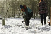 Misty Raney shovels snow.