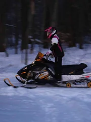 Man on a snowmobile.