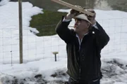 Marty Raney pushes a plank of wood.