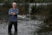 Jeremy standing in water.