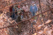 Trapper showing the AIMS team the trap.