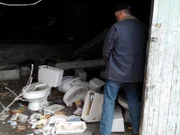 In the garage of the abandoned boarding school, Brian Gurry finds an obscene amount of toilets.