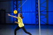 Bailey serving the tetherball.