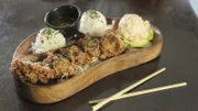 The Garlic Furikake Chicken as served at Broke Da Mouth Grindz in Kailua-Kona, Hawaii, as seen on Diners, Drive-Ins and Dives, Season 28.