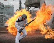 REENACTMENT: American Serviceman running through harbor whilst under attack.