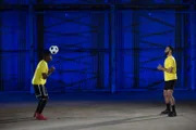 George headers the ball.