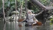 Myke and Ruth on Boat in Colombia paddling from behind.