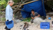 Myke and Ruth building shelter.