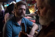 Chip Baskets (Zach Galifianakis, l.); Rambling Cowboy (Ritchie Montgomery, r.)