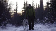 Alex Javor walks with his dog, Sipsey, during the winter. (National Geographic)
