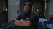 Scott Taylor standing beside his car "John Doe".