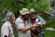 L-R: Charlie Snider, Chad Ollinger and Eric Drummond look at the drone’s remote control display.