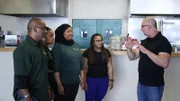 Robert talks to Luvinia, Jameel, and two of their daughters, Ayana and Arabia, before they load out the restaurnt.