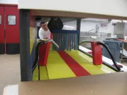 Buddy Valastro works on the interior of the car cash cake.