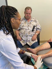 Dr. Ebonie Physically checking on Alisa’s foot