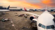 View of airplane at the airport at sunrise