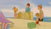 Zusammen mit Jakob, Mama und Papa baut Conni die schönste und größte Sandburg.