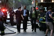 L-R: Detective Ed Green (Jesse L. Martin), Detective Nina Cassady (Milena Govich)