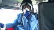 Doctor Tim in the back of the helicopter, monitoring the patient during their journey to hospital