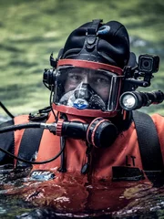 Paul Richardson in water in dive uniform.