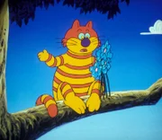 Die Grinsekatze ist enttäuscht. Sie hatte sich von den blauen Zauberblumen viel versprochen, doch sie scheinen die falschen zu sein.