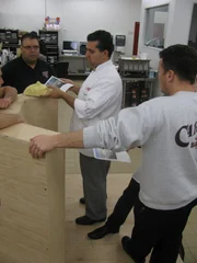Frankie, Buddy and Joey discuss cake build.