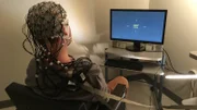 A student of Dr. John Kounios, Ph.D., Director of the Ph.D. Program in Applied Cognitive & Brain Sciences & Professor in the Department of Psychology at Drexel University, participates in a scientific experiment.