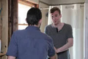 Eric says goodbye to his friend whose bathroom he helped grout.