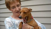 Marcia holds her sleepy Miniature Pinscher, Jack as seen on episode five of Dogs 101.