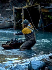 Scott Allen holding the rock basket rope.