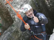 Homun, Mexico - Guillermo de Anda enters cenote San Antonio. The cenotes are considered a very holy place as the entrance to the underworld.